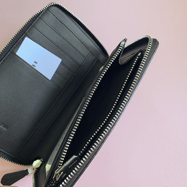 【関税・送料込】【コーチ x スヌーピー】●レア!●機能的でコンパクトなお財布